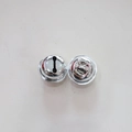 Detail of two silver vacuum plated metal round bells for DIY pet collars and holiday decor - Silver