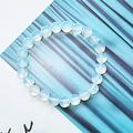 8mm light blue cat-eye stone bracelet with gradient glass beads on striped background - Opal