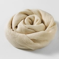 Solid beige cotton linen scarf rolled into a rose shape with soft fabric texture - Off White