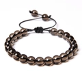 Macro detail of polished brown tiger eye stone beads on adjustable woven cord bracelet - Smoky Quartz