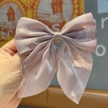 Pale pink bow hair clip with shimmering fabric texture for elegant ponytails - Mermaid Bean Paste Pink