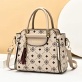 Beige large capacity faux leather handbag for women with monogram print and tassel detail - Khaki