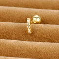 Macro shot of gold-plated stainless steel cartilage stud with five white cubic zirconias - 65040-4 Column with 5 Stones / Gold
