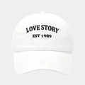 Close-up of white cotton baseball cap with Love Story embroidery and stitched brim - Adjustable / White