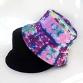 Detail of reversible bucket hat showing classic black and vibrant tie-dye pattern textures - Mixed Color Tie-dye