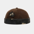 Detail view of corduroy docker hat featuring star embroidery and camouflage cuff design - Adjustable / Coffee/Camouflage