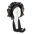 Floral satin sleep bonnet with wide elastic black tie band on a model head - Small Black Floral