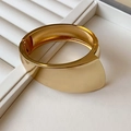 Minimalist wide gold-plated metal cuff bracelet featuring a glossy asymmetric curved design - 59# Modern Irregular Wide Curved Surface Style / Gold