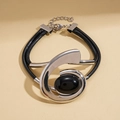Detail of double-layer black cord necklace with oval black stone and silver metal - Bracelet - Silver