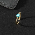 Anello regolabile dorato con occhio greco blu in smalto e zirconi su pietra nera - O-Occhio Blu Cielo Sei Zirconi