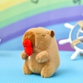 Primer plano de un lindo llavero de carpincho de peluche marrón con un globo rojo - Capibara Festivo - Espinos de Fuego Confitados / 12cm