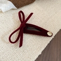 Detailed view of a dark red velvet bow hair clip with gold Smile Happy metal charm - Red - Single Bow (BB Clip)
