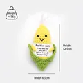 Detail shot of a handmade crochet corn toy with size dimensions and weight info - Corn