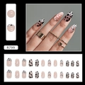 Detail view of almond press-on nails with leopard print and pink gradient heart designs - Cow Spot Pattern (R799)