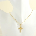 Detail of cross pendant with yellow stones and white crystals on a gold chain - Gold Snake Chain / Yellow Zircon