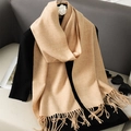 Classic camel faux cashmere scarf with fringe on black top in aesthetic lifestyle setting - Dark Camel