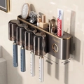 Wall-mounted dark grey toothbrush holder with 4 smoked cups and gold-trimmed accent - 4-Cup Style + Toothpaste Squeezer-Gun Grey-Magnetic
