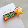 Macro detail of Christmas hair clip with Jingle Bells text, red hat and star elements - Style 34 Christmas Hair Clip