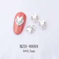 Macro shot of silver heart nail art alloy with small rhinestones and white faux pearl - Silver Butterfly Pave Pearl Heart (8889)