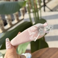 Close-up of pink fabric hair tie with white lace, ribbon bow and cute puppy badge - Teddy Lace Bow Pink BB Clip