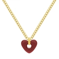 Minimalist golden heart necklace featuring a red hollow zircon pendant on a white background - Gold Hollow Red Heart