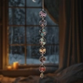 Vertical crystal suncatcher with seven colorful stone butterflies hanging by a window - Seven Butterflies