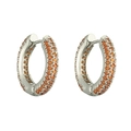 Close-up of luxury silver hoop earrings with three rows of pavé-set orange crystals - Platinum Orange Zirconia