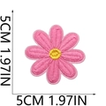Macro detail of a 5cm pink daisy embroidered patch with yellow center and fine stitching - No.10-Eight-Petal Daisy