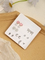 Detail view of 7-day stud earring set with pink heart, snowflake, and pearl motifs - Pink Heart Moon Leaves (FX885-11)