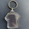 Clear acrylic keychain in T-shirt shape with silver ring on dark leather background - T-Shirt Shape 4.8x4cm