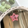 Sparkly pink star-shaped Y2K BB hair clip with glitter finish on a vintage mirror - Pink Glitter