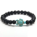 Elastic beaded bracelet featuring matte black stones and a blue turquoise turtle charm - Matte Black Stone (NL04-3)
