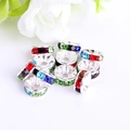 Macro detail of colorful crystal spacer beads with metal base for DIY jewelry making - Silver Plated Mixed Color