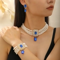 Détail d'un collier de perles multicouches et bracelet avec pierres bleues et or rose - Ensemble Perles Artificielles Multi-Rangs Pierre Bleue (S559)