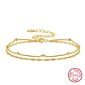 Gros plan détaillé du poinçon S925 sur un bracelet double couche en argent sterling doré - Argent Sterling 925 Plaqué Or 14K / Or 14K