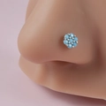L-shaped flower nose stud with turquoise blue beads and silver accents on model - Blue Six Bead Flower