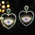 Sparkling blue evil eye heart stud earrings with green and white crystals in gold finish - Emerald Evil Eye