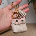 Beige leather owl coin purse keychain with golden hardware and matching tassel - Beige