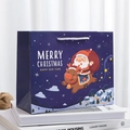 Dark blue Christmas gift bag with cartoon Santa and elk on a sturdy paper carrier - Santa Reindeer