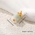 Detail shot of a gold-plated stone pendant showing dimensions 16.5mm by 8.8mm - White Carved Rose
