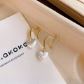 Elegant gold heart earrings with white pearlescent pendants on a jewelry card - E6505 Gold Pearly Heart Drop