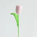 Handmade pink crochet tulip flower with green leaf on a clean white background - Closed Tulip Light Pink