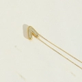 Gold letter A pendant necklace with pavé cubic zirconia on minimalist fine chain - Letter V