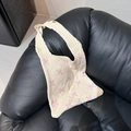 Close-up of cream knitted tote bag featuring delicate pink bow patterns and soft texture - Beige with Pink Bow