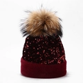 Detail of burgundy sequin knitted beanie with fluffy raccoon fur pompom and plush cuff - One Size / Wine Red (Natural Pom Pom)