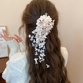 Detailed view of cream floral hair clip with long tassels and pearl beads on hair - 27# Duckbill Clip - Pink/White - Long Tassel Beige Style Single