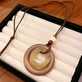 Bohemian geometric necklace with wood and resin ring pendants on brown braided rope - Style 11 Leather Round Bead Ceramic Resin Necklace