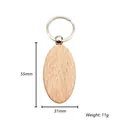 Detail view of oval beech wood keychain with 55mm height and natural grain finish - Oval Style (Style 6)