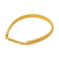 Close-up of golden Tubogas snake bone choker with H-link chain buckle on white background - Gold Necklace