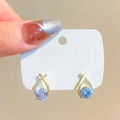 Elegant gold-tone tassel earrings featuring light purple zircon crystals in a drop design - Pale Purple Rhinestone Cross Style (Cross K-236)